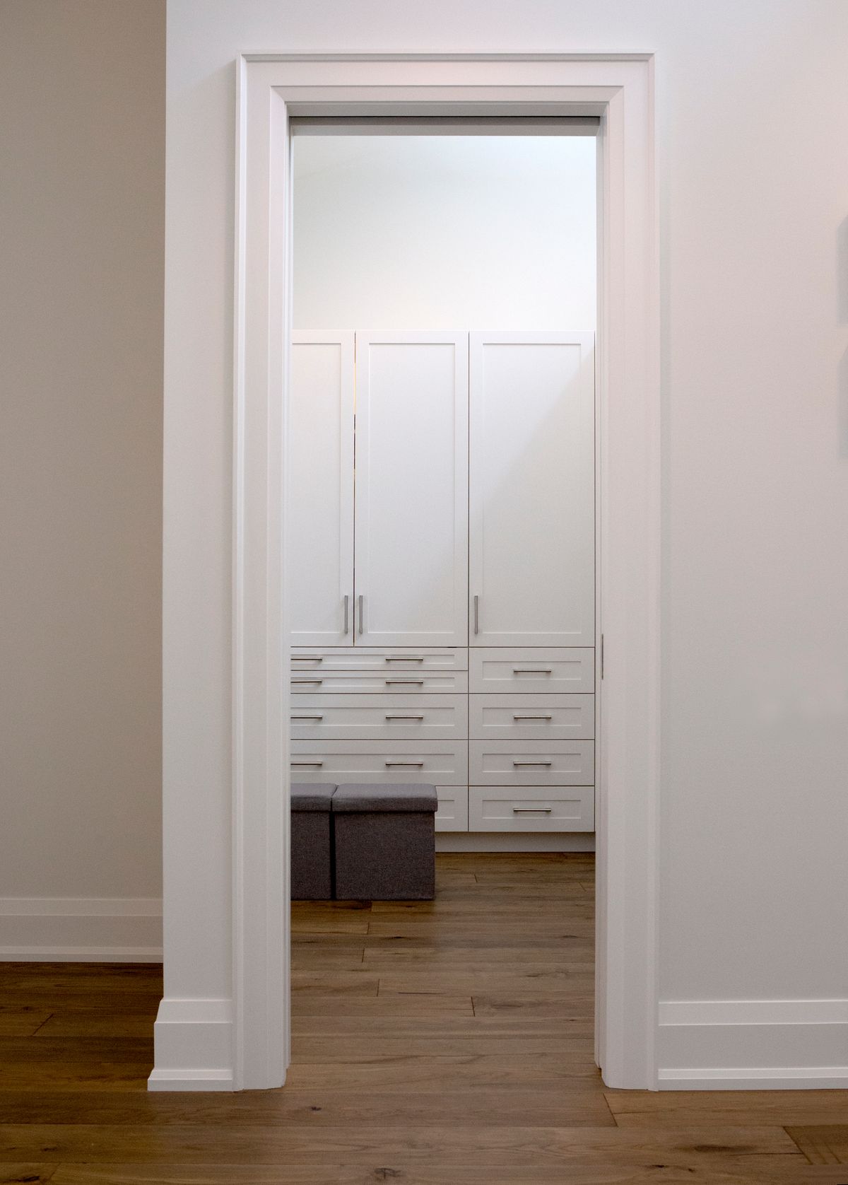 luxury walk in closet with white doors-1