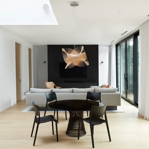 Minimal modern living room with circular pendant lighting