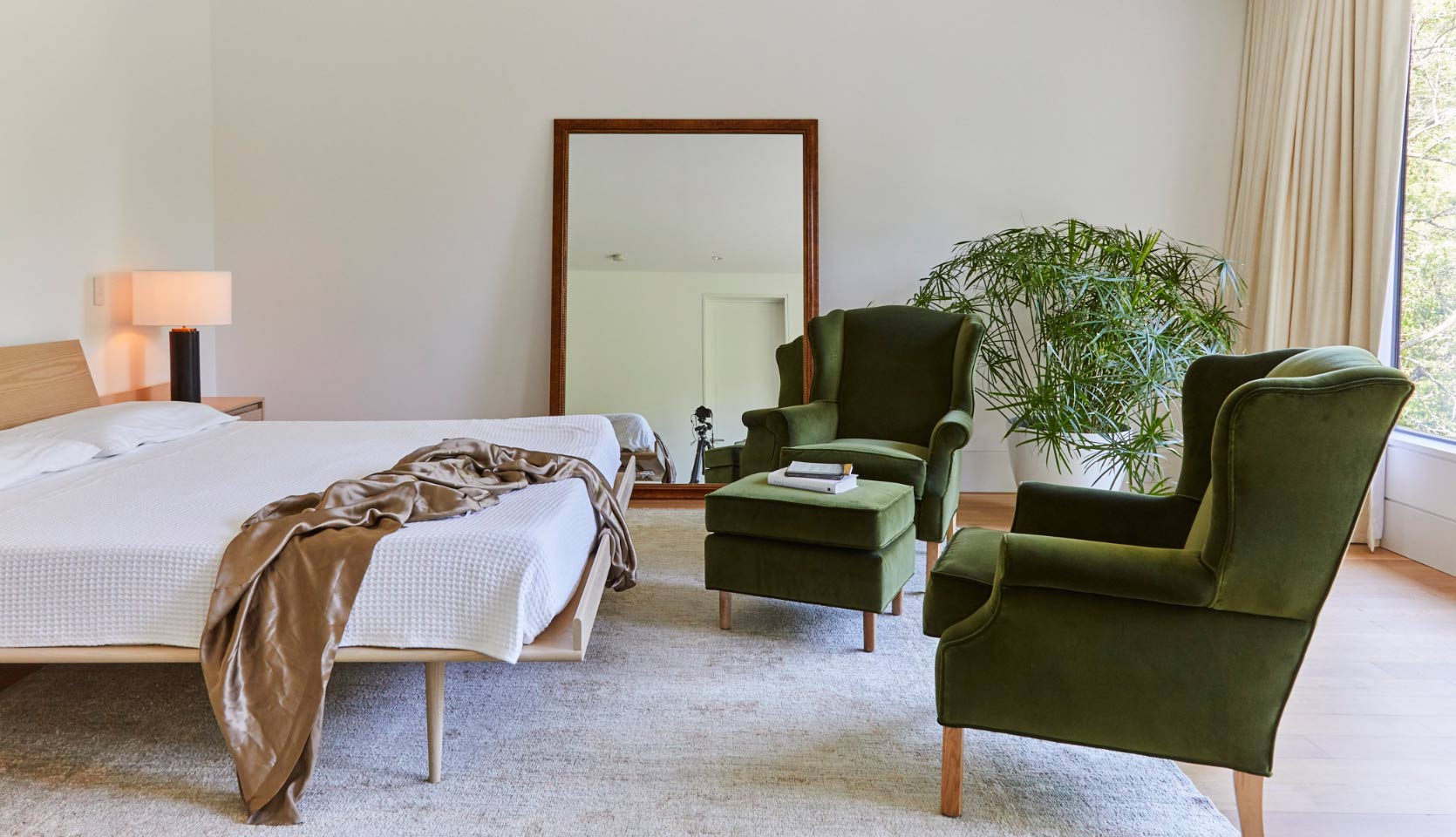 Master bedroom of home with south-facing floor to ceiling windows