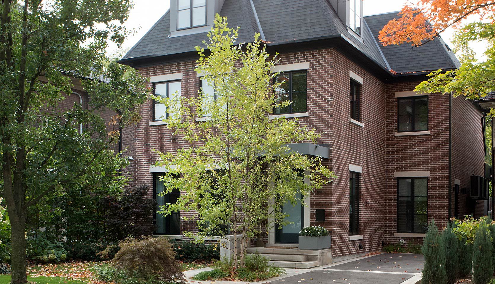 Brick Custom Home Exterior with Three Steps Leading to Front Door