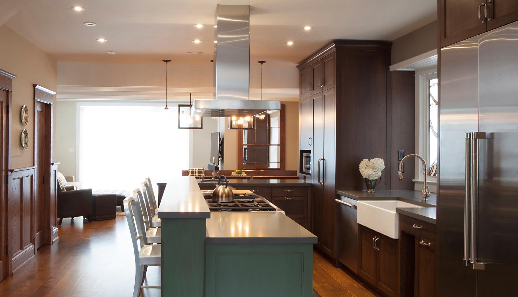 Modern kitchen renovation with dark stained shaker cabinets and kitchen island