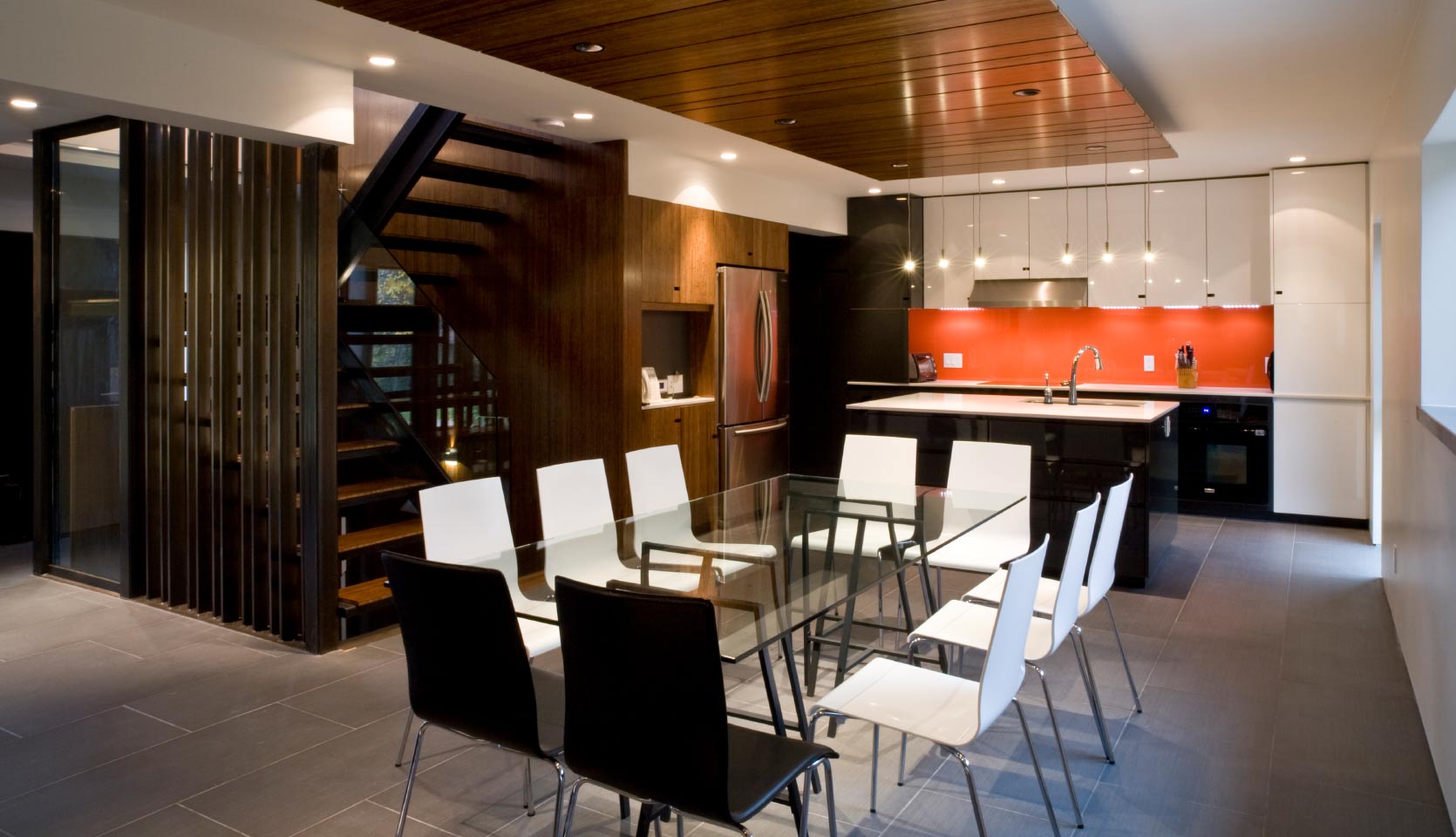 north-york-house-dining-with-kitchen-in-back-and-orange-backsplash