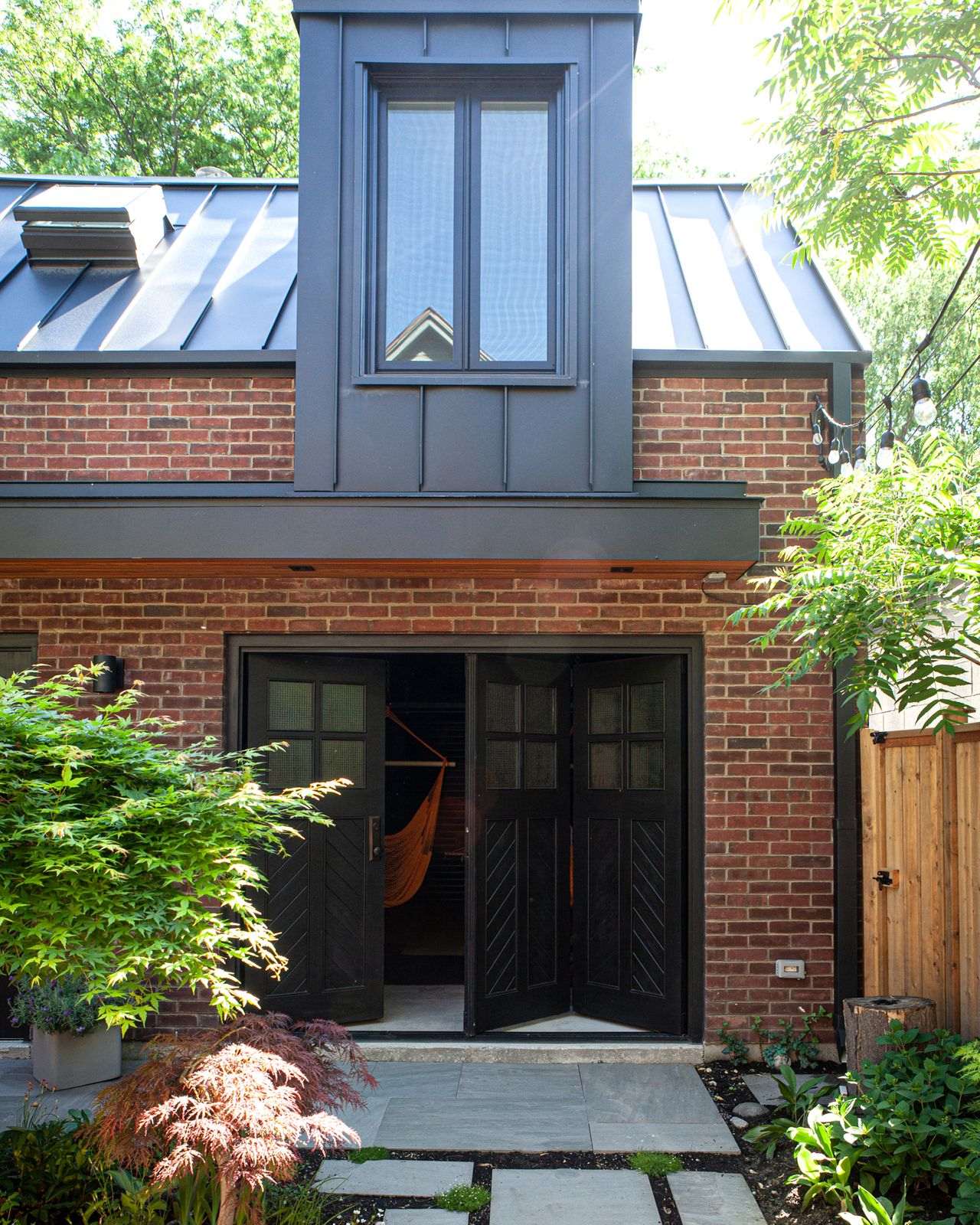 Bi fold door with hammock in backyard of home Bi fold door with hammock in backyard of home
